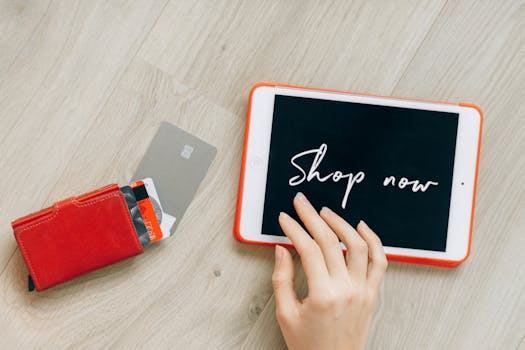 Close-up of a digital shopping theme with a tablet and credit cards, highlighting a modern retail experience.